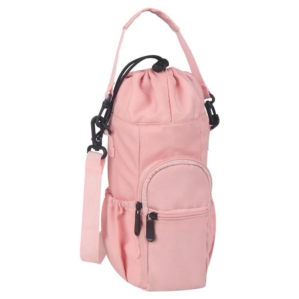 Canvas crossbody water bottle pouch in black green and pink holding a cup