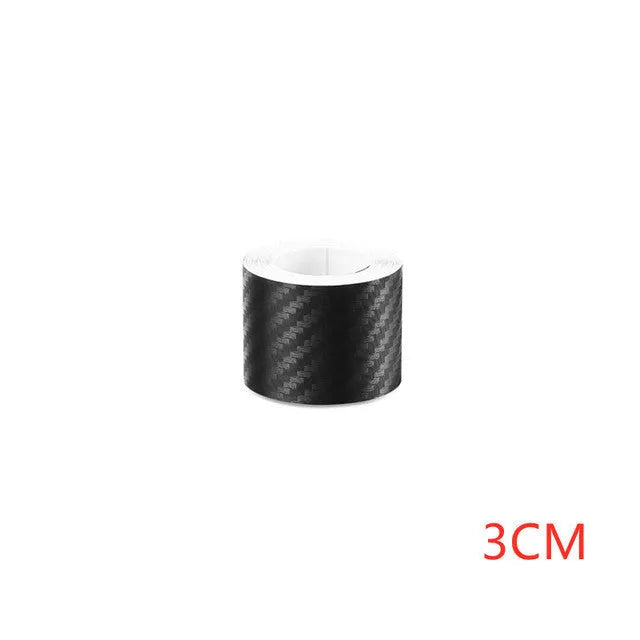 Roll of matte black carbon fibre patterned vinyl with adhesive backing for car door sill protection.