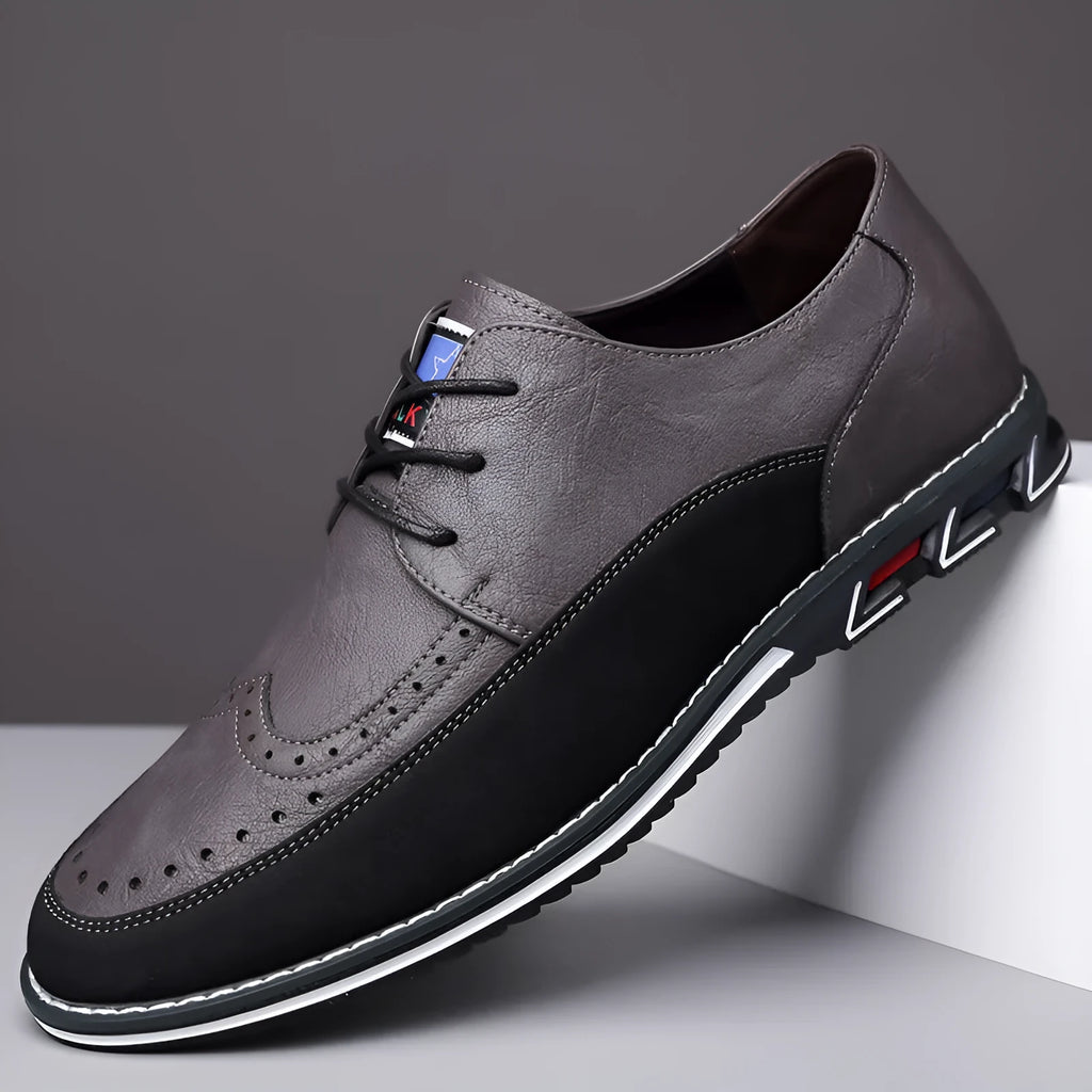 Men's black casual leather slip-on shoe with rubber sole and leather toe cap detail
