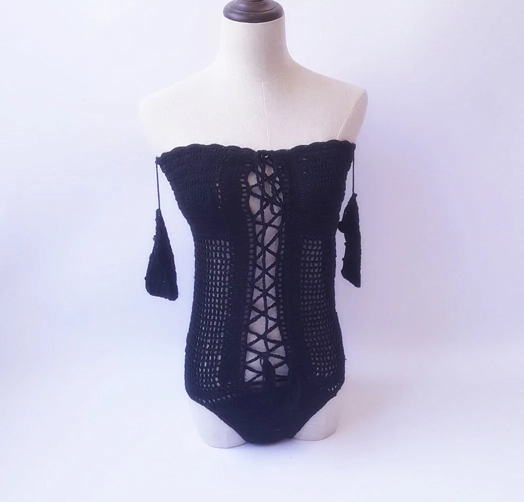 Off-shoulder one-piece swimsuit on a mannequin in light pink colour.