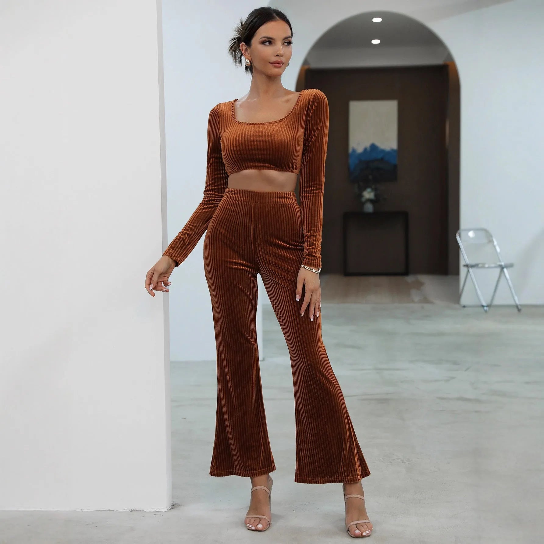 Caramel coloured women's long sleeve sweater and matching trousers casual two-piece set.