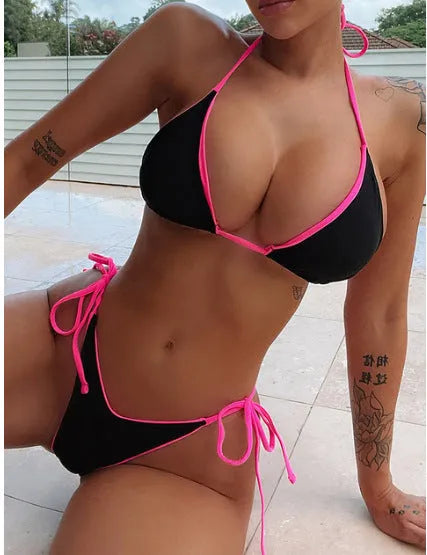 Women's lace-up front triangle bikini top with high-waisted split-leg swimsuit bottoms.
