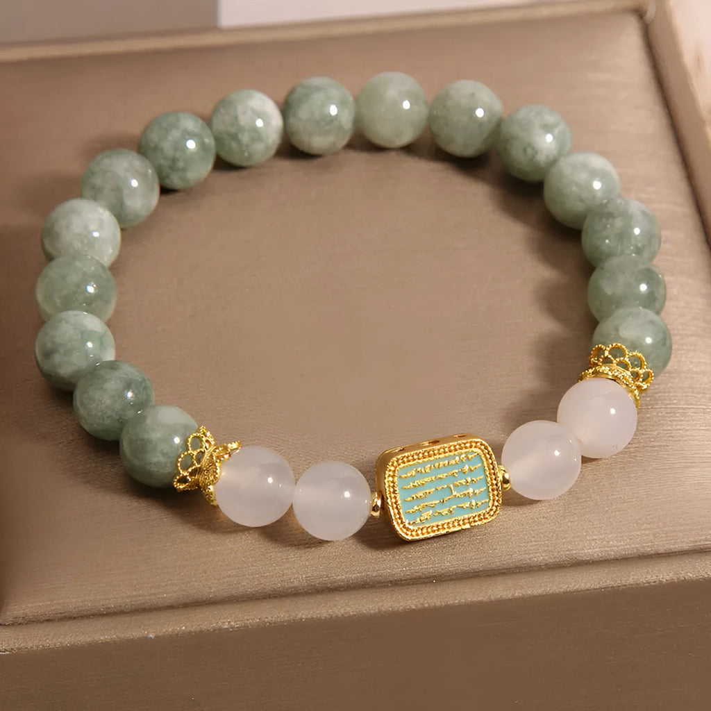 Oil green emerald crystal bracelet for women with five scripture charms on a white background.