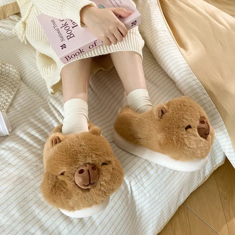 Light brown plush women's winter slippers with artificial wool lining and a round toe.