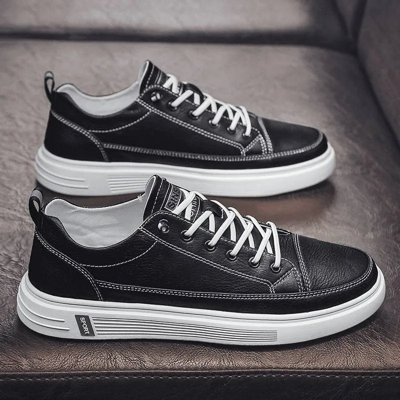 Men's white casual shoes with round toe and flat low heel on a plain background