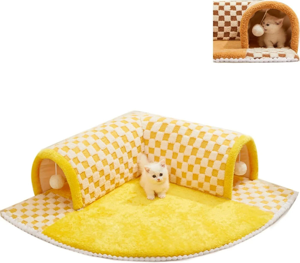 Brown plush plaid cat tunnel bed with central mat on a wooden floor.