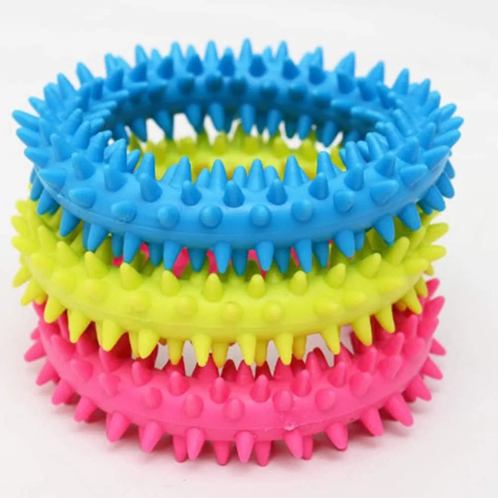 Blue TPR spiky ring dog chew toy with dental cleaning nubs on a white background