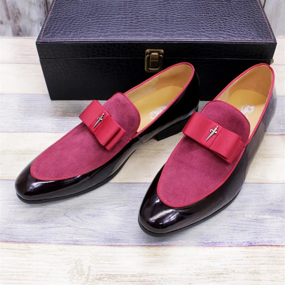 Men's black patent leather low-top shoes with a gold tassel detail and rubber sole.