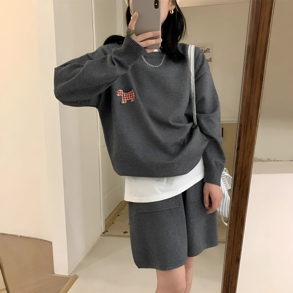 Women's milk blue casual knitted sports suit with animal embroidery on top and matching shorts.