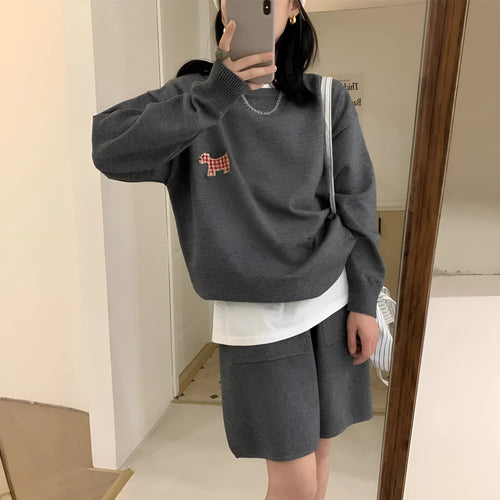 Women's milk blue casual knitted sports suit with animal embroidery on top and matching shorts.