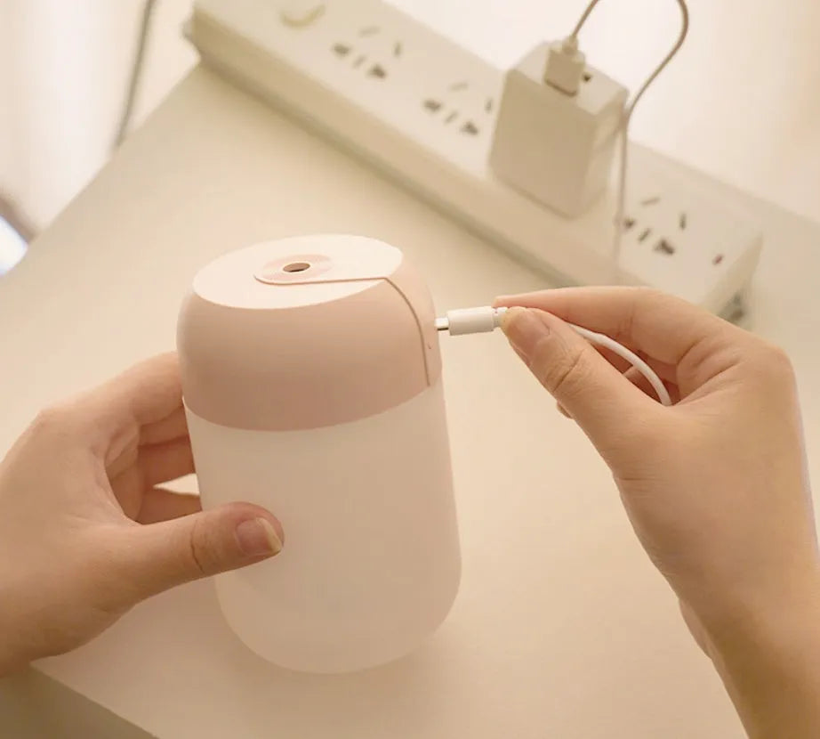 White cylindrical mini humidifier with USB port and aromatherapy function for small-space moisture control