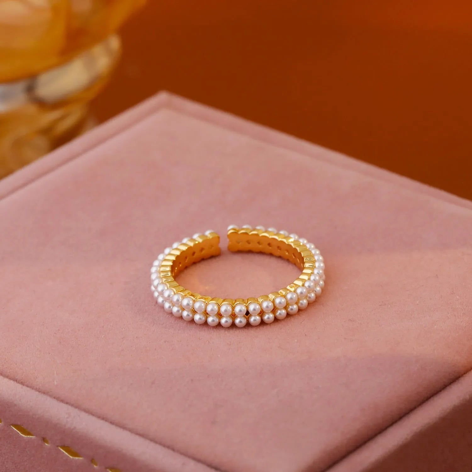 Gold electroplated open mouth ring with geometric design and round elements for women