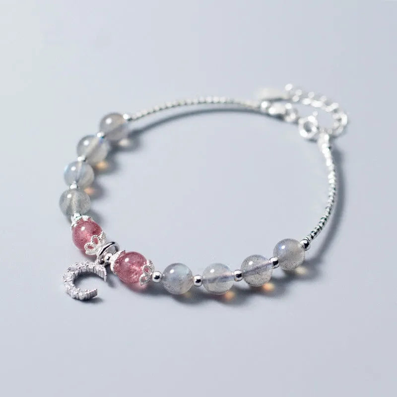 Handmade silver-tone adjustable bracelet with a 6mm moonstone bead and a small crescent moon charm.