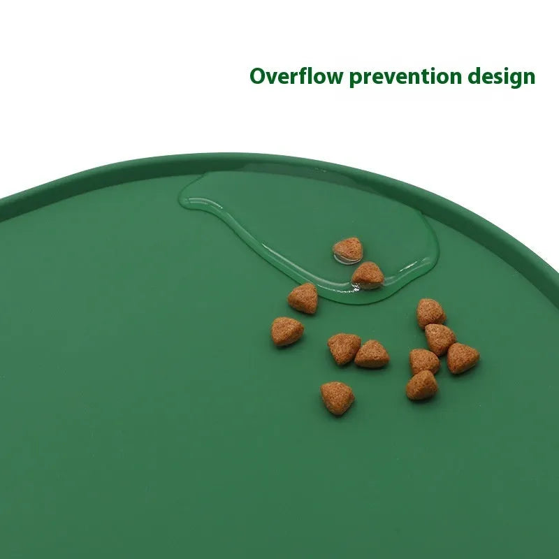 Silicone waterproof cat feeding placemat in beige colour on a wooden floor next to a pet bowl.