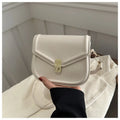Soft textured PU shoulder messenger bag in horizontal square clamshell design.