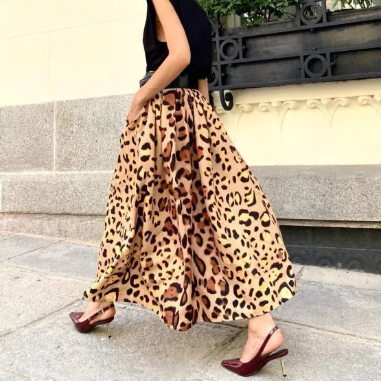 Brown leopard print women's A-line long skirt with big hem design shown in socialite styling