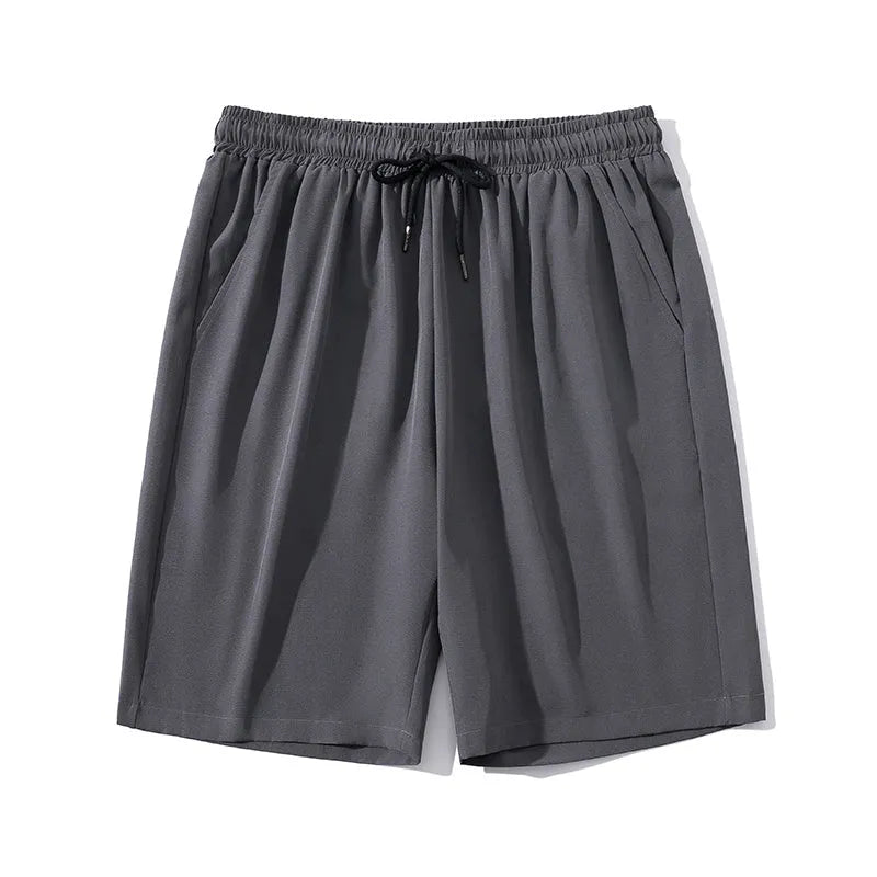 Man wearing black cropped straight-leg sports casual pants made from quick-drying nylon fabric.
