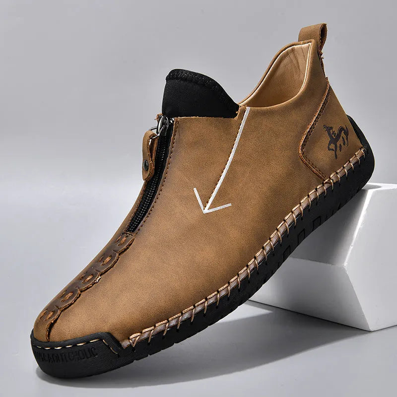 Men's brown leather-look zip-up martin boots with a round toe and rubber sole on a white background.