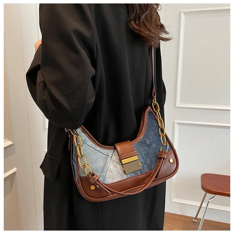 Brown denim women's shoulder bag with diamond mesh panel and chain strap showing bucket shape