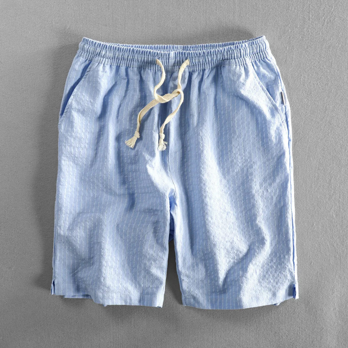 Men's striped casual shorts in loose straight-leg fit with elastic waistband.