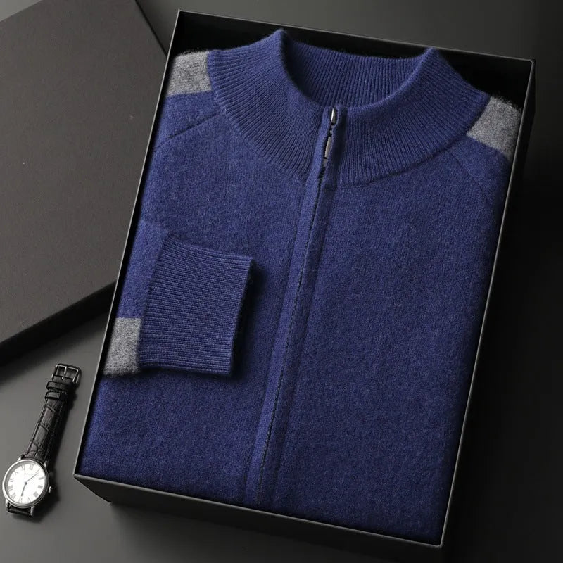 Men's navy blue cashmere blend knitted cardigan suit with half turtleneck and zip, paired with matching trousers.