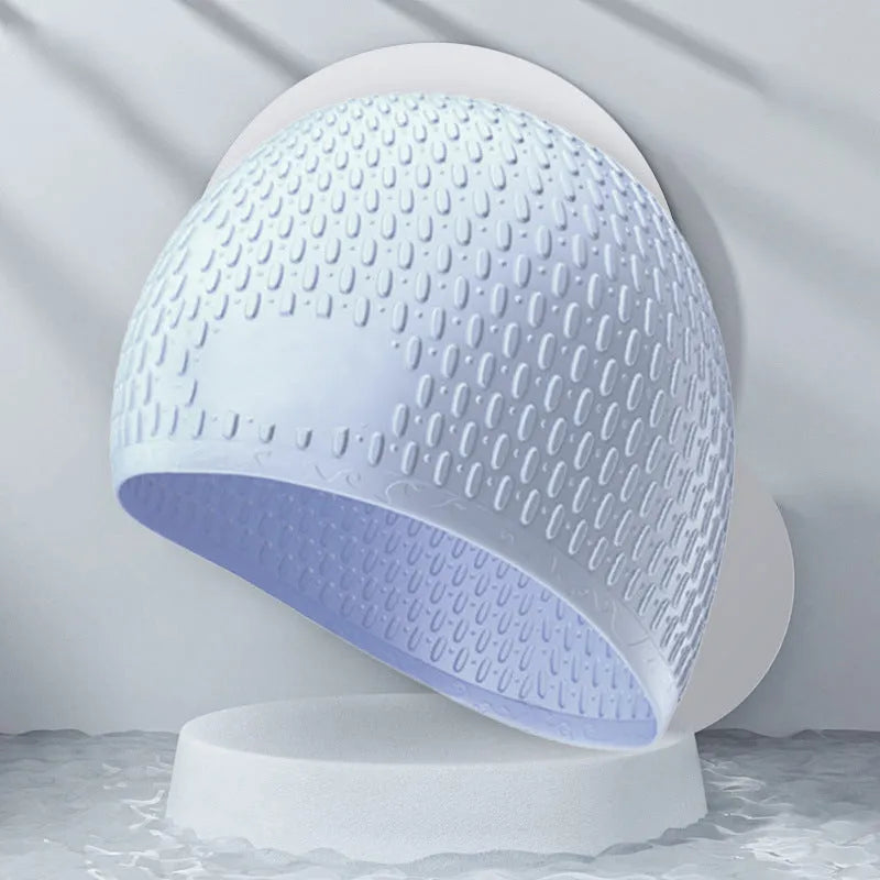 Silicone water drop design swimming cap for adults shown in various colours.