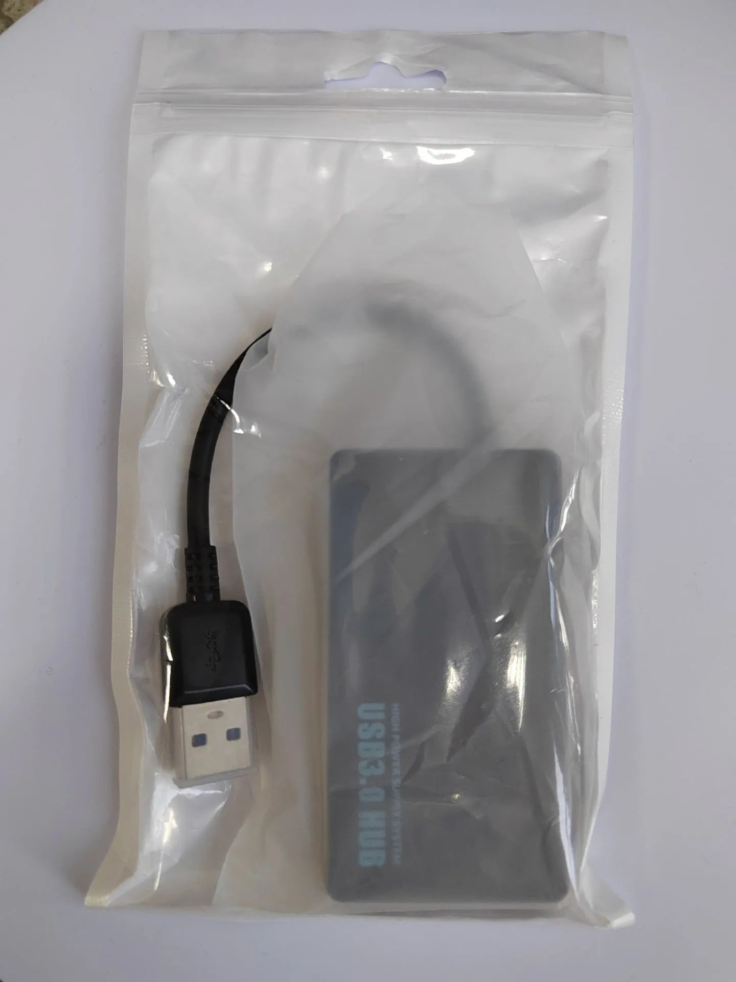 USB extender hub with 20cm cable showing multiple USB ports in pearlescent bag packaging
