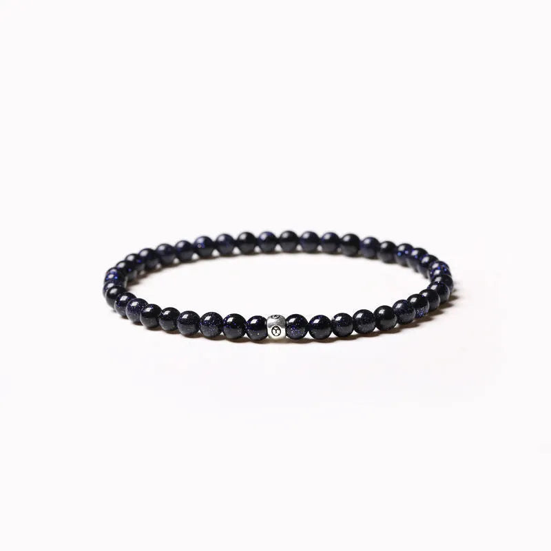 Fine geometric agate bracelet with round and square 4mm beads in obsidian, blue san, and black agate colours.