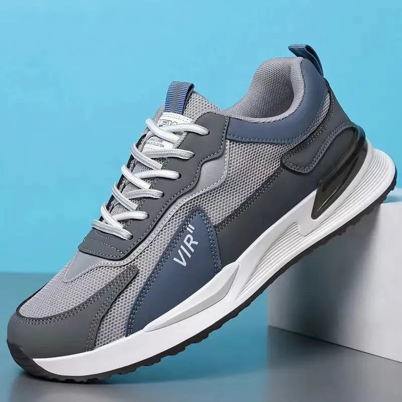 Men's colour block mesh running sneakers in black, grey, and white on a plain background.