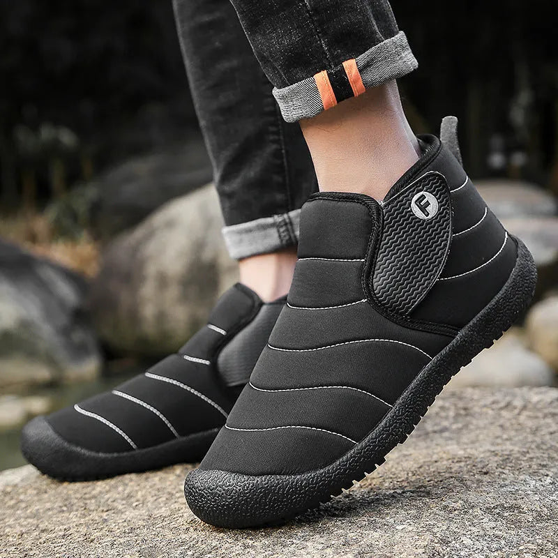 Men's waterproof snow boots in black with a cotton upper and thick rubber sole.