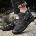 Men's waterproof snow boots in black with a cotton upper and thick rubber sole.