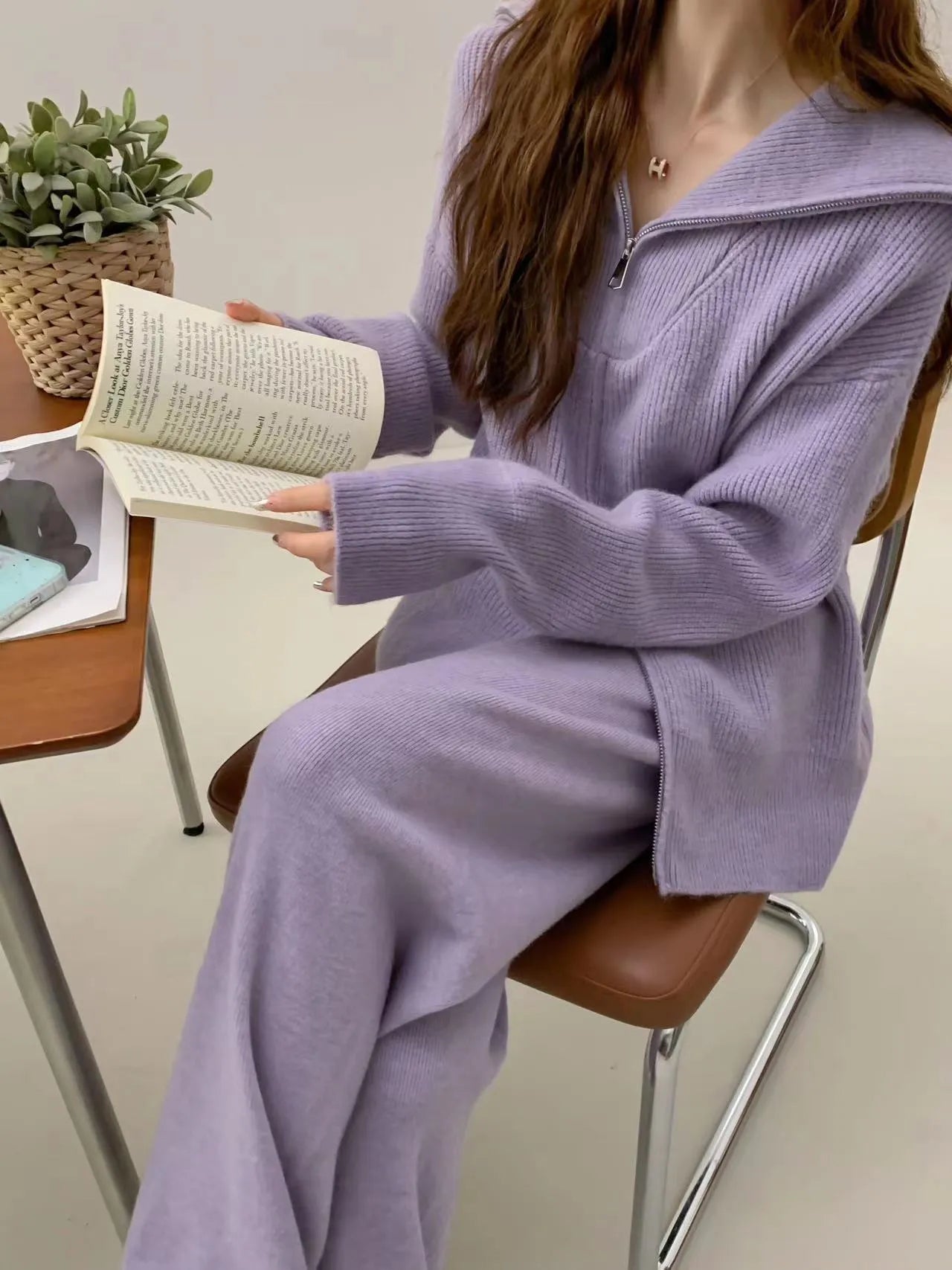 Beige knitted zip cardigan and wide-leg trousers two-piece set on a model