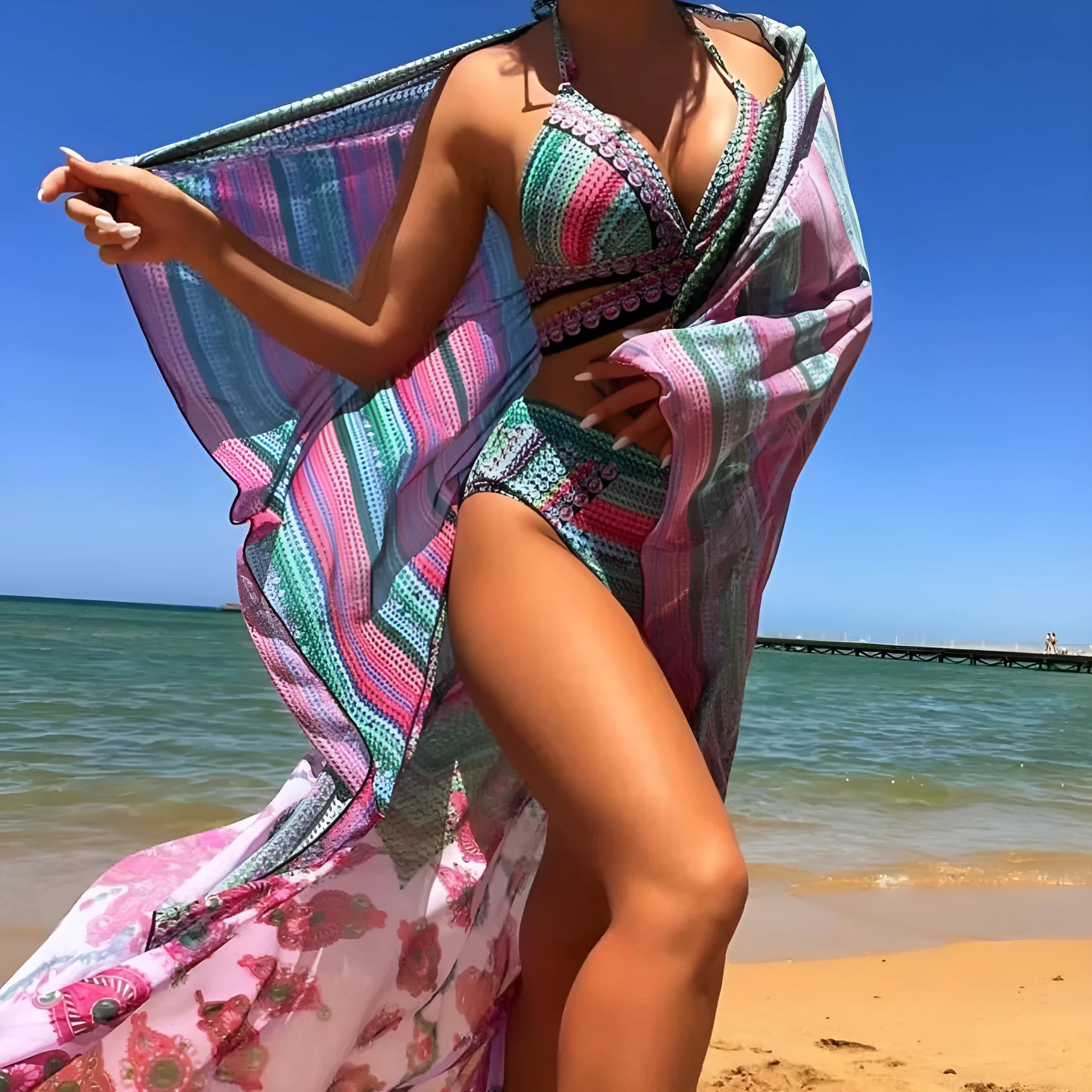 Blue cross bandage bikini top with high-waisted bottoms and matching smock cover-up.
