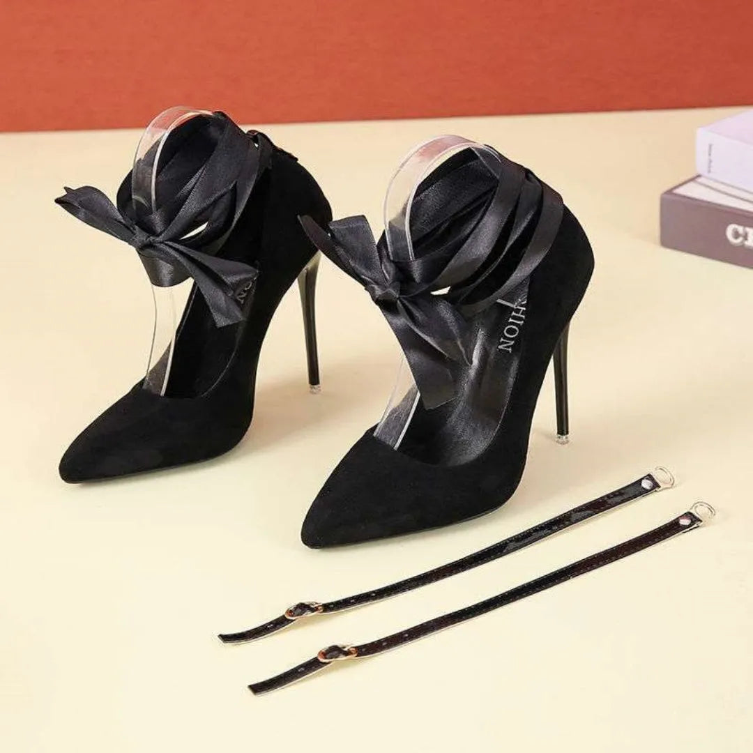 Black platform heel with shallow open toe and thin lace straps on a 12cm heel.