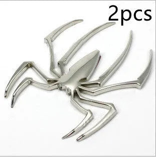 3D metallic spider bumper sticker in gold, silver, black, and red colour options.