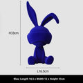 Green suede blindfold rabbit resin table ornament on wooden surface