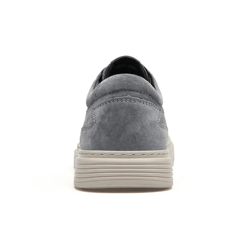 Men's grey and sand coloured low-top casual skate shoes with round toe and lace-up front.