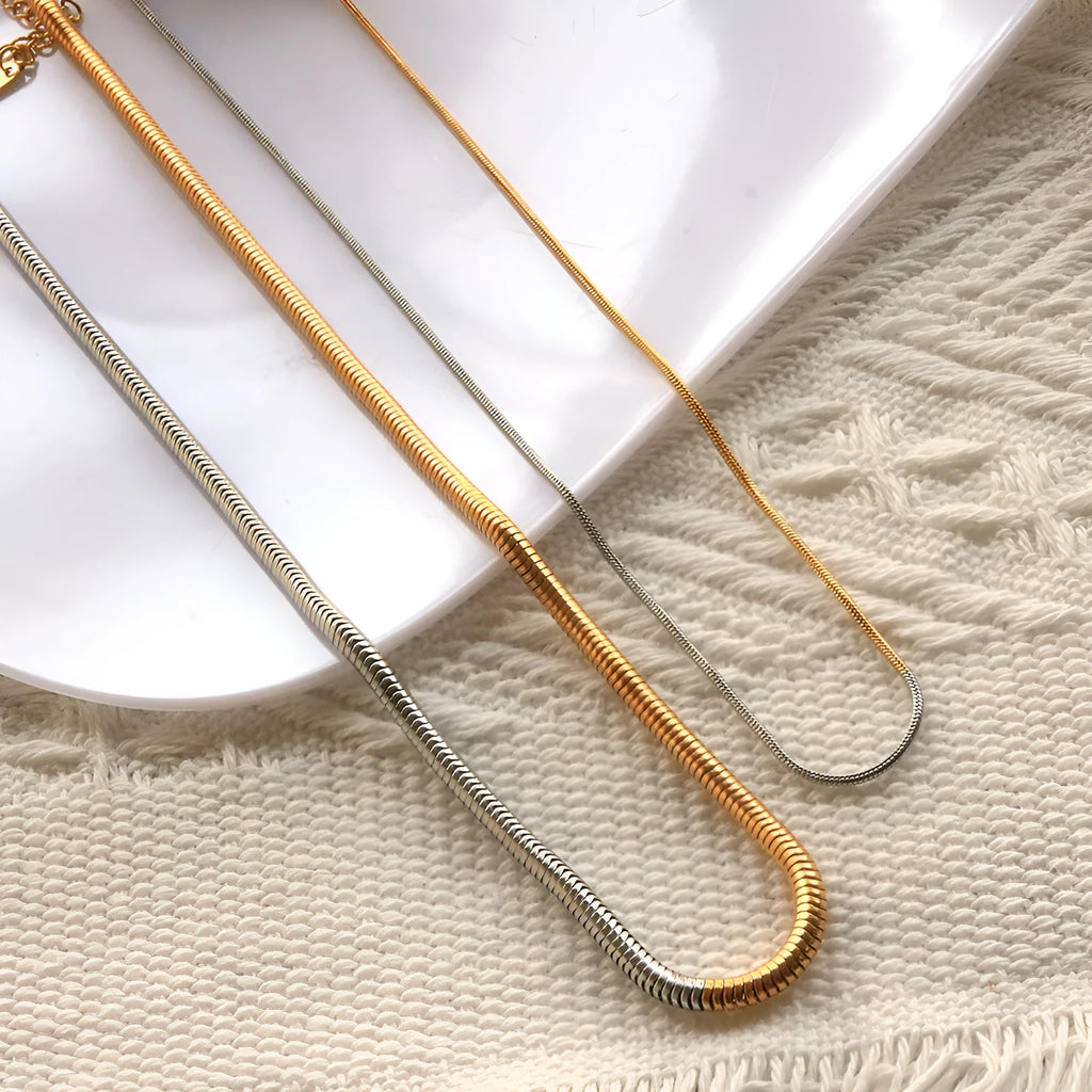 Women's stainless steel snake bone chain necklace with 3mm cold golden plating and geometric design