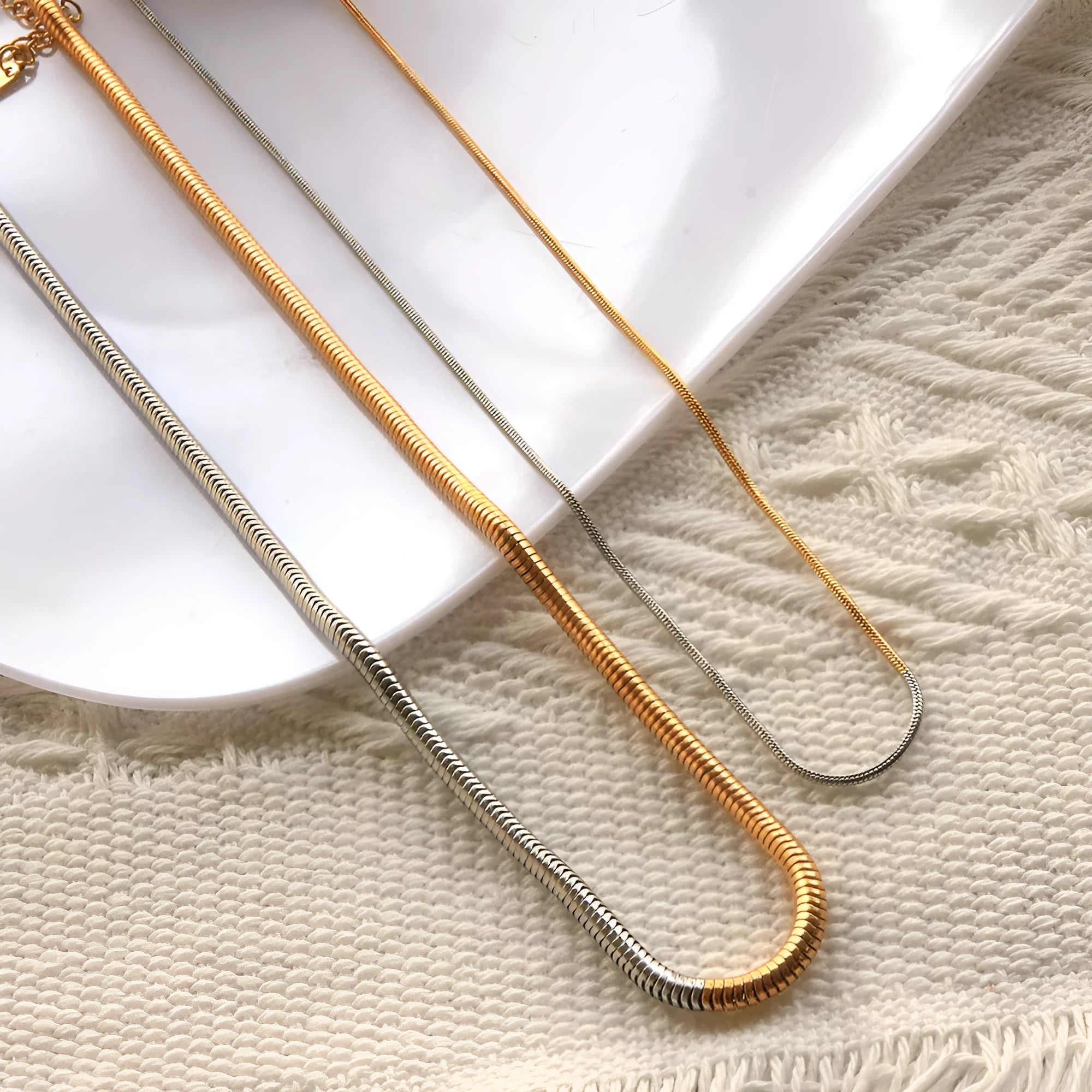 Women's stainless steel snake bone chain necklace with 3mm cold golden plating and geometric design