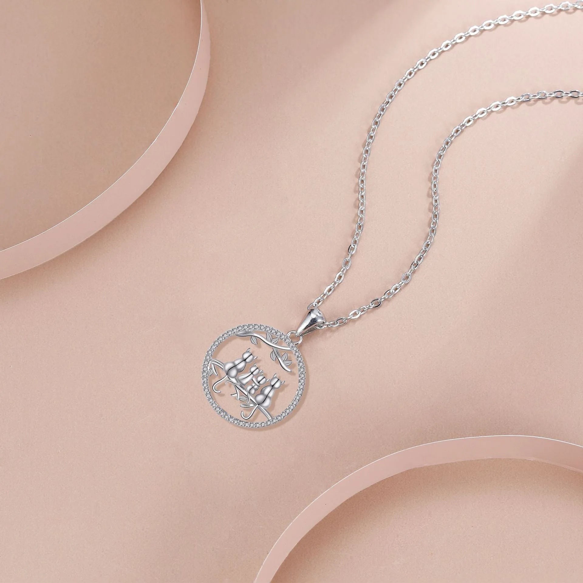 Four kitten pendant necklace with copper chain and cross link design
