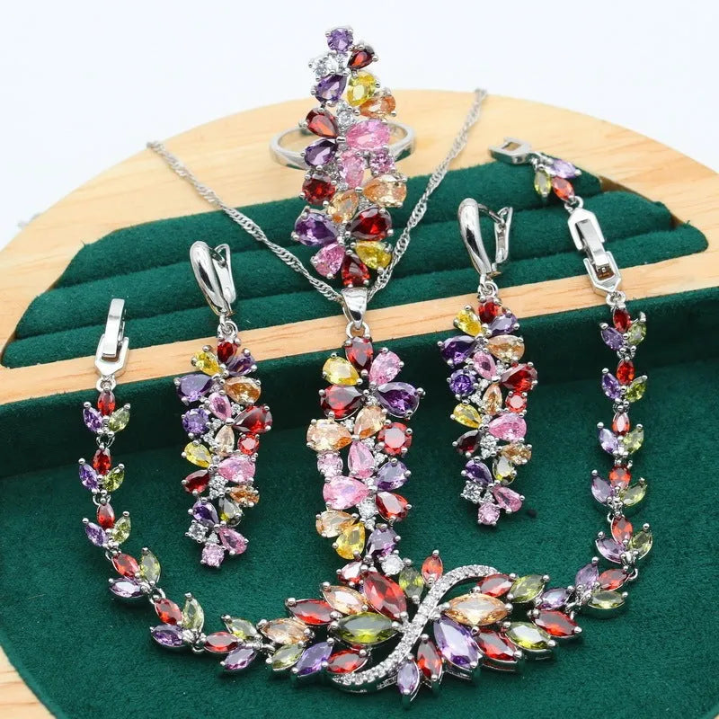 Complete retro floral jewellery set in copper with zircon stones, showing necklace, bracelet, earrings, and ring in olive green finish.