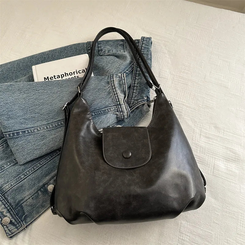 Women's black PU leather single shoulder bag with horizontal square shape and dedicated phone compartment