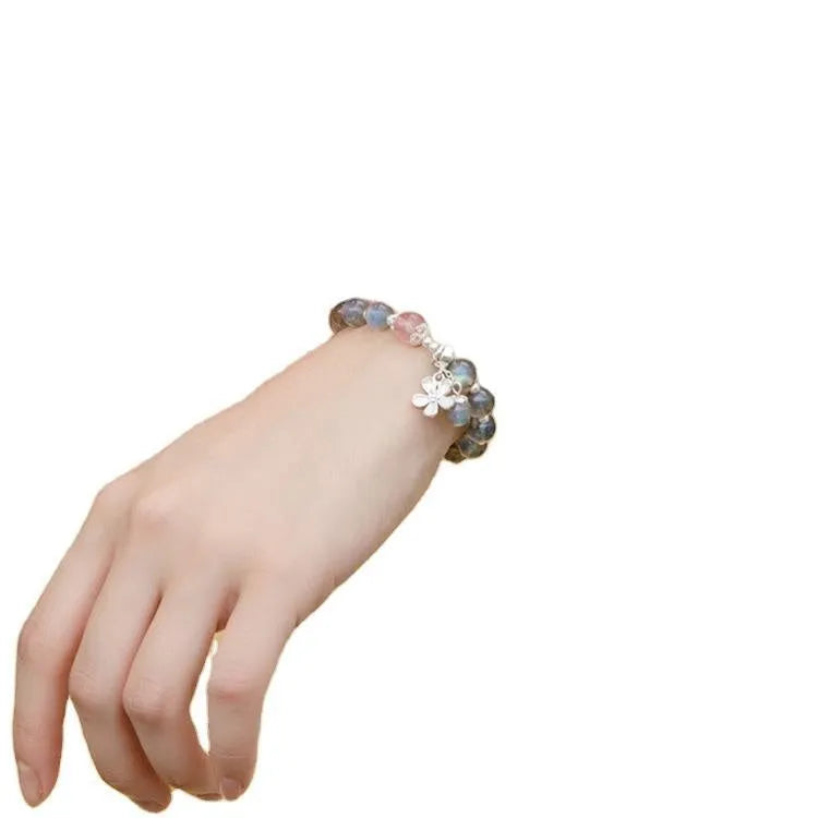 Women's silver bracelet with grey moonlight finish, 7.5mm lime and strawberry crystals, zodiac animal motif, and honeysuckle charm.