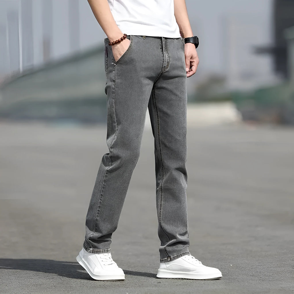 Men's smoky gray straight leg jeans with low waist and zip fly made from elastic rabbit fur fabric
