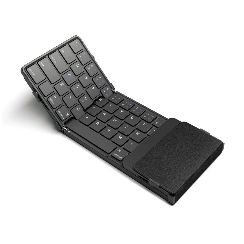 Black folding Bluetooth keyboard collapsed to compact size for mobile phones and tablets