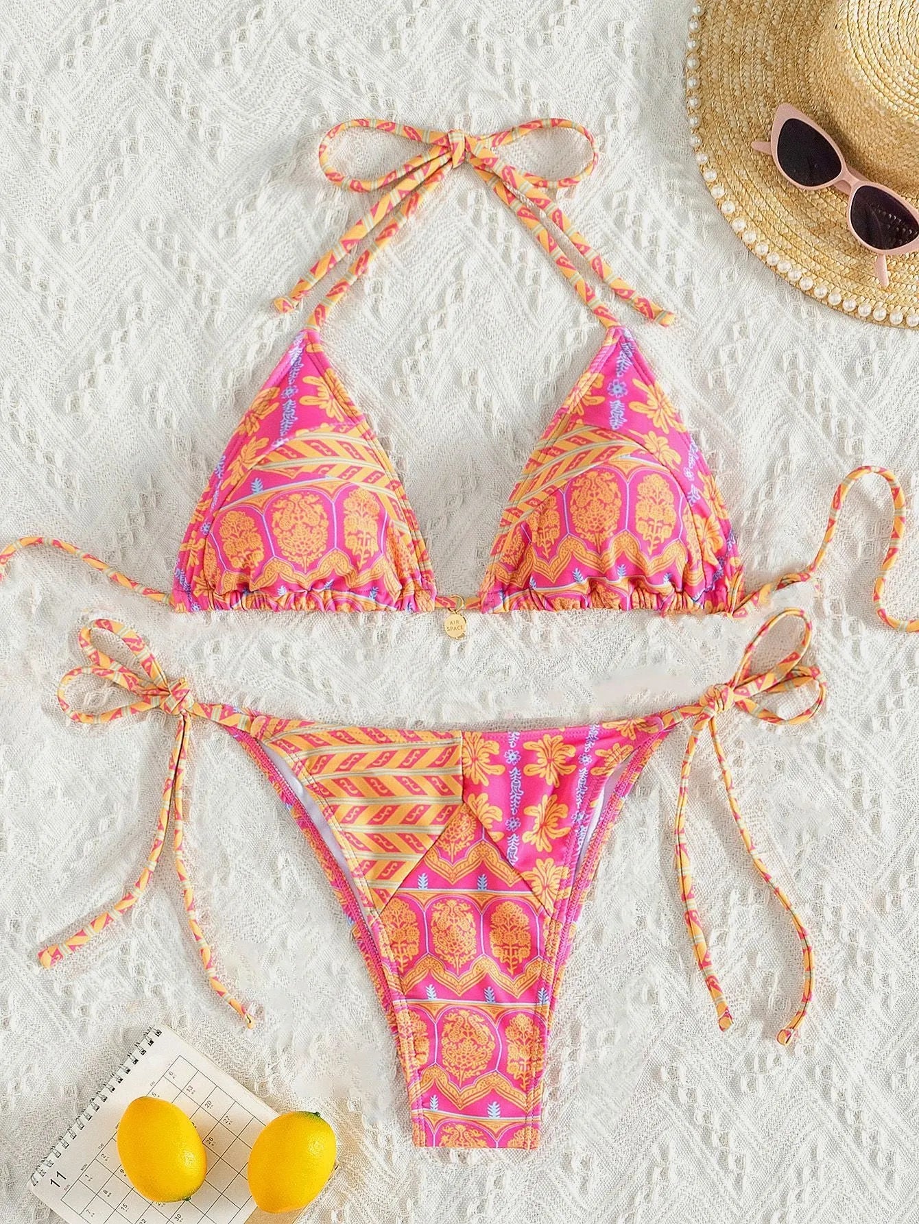 Women's split bikini swimsuit with bandage stitching in polyester fabric, available in multiple colours