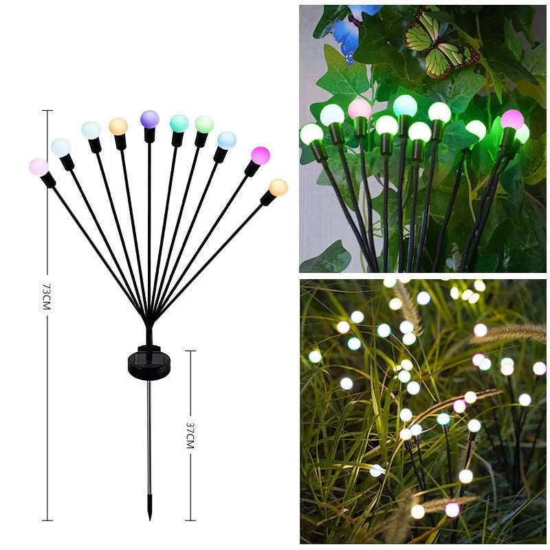 Solar-powered LED garden ground light with stainless steel spike inserted in lawn showing automatic dusk-to-dawn operation