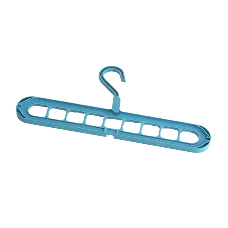 A green plastic multifunctional hanger with nine holes for trousers, shown in a folded and unfolded position.