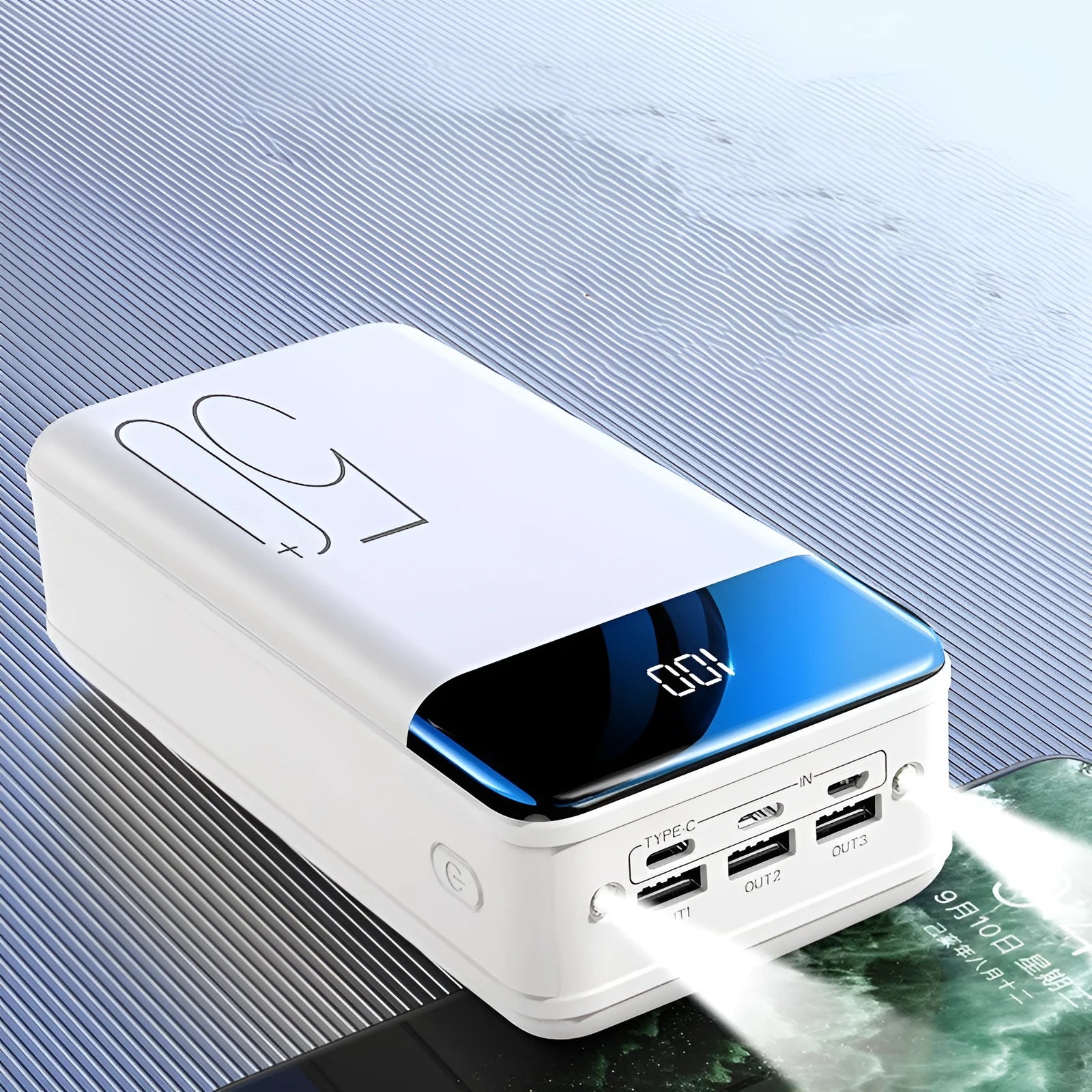 Black and white 50000mAh power bank with three USB output ports showing dimensions 169x83x52mm