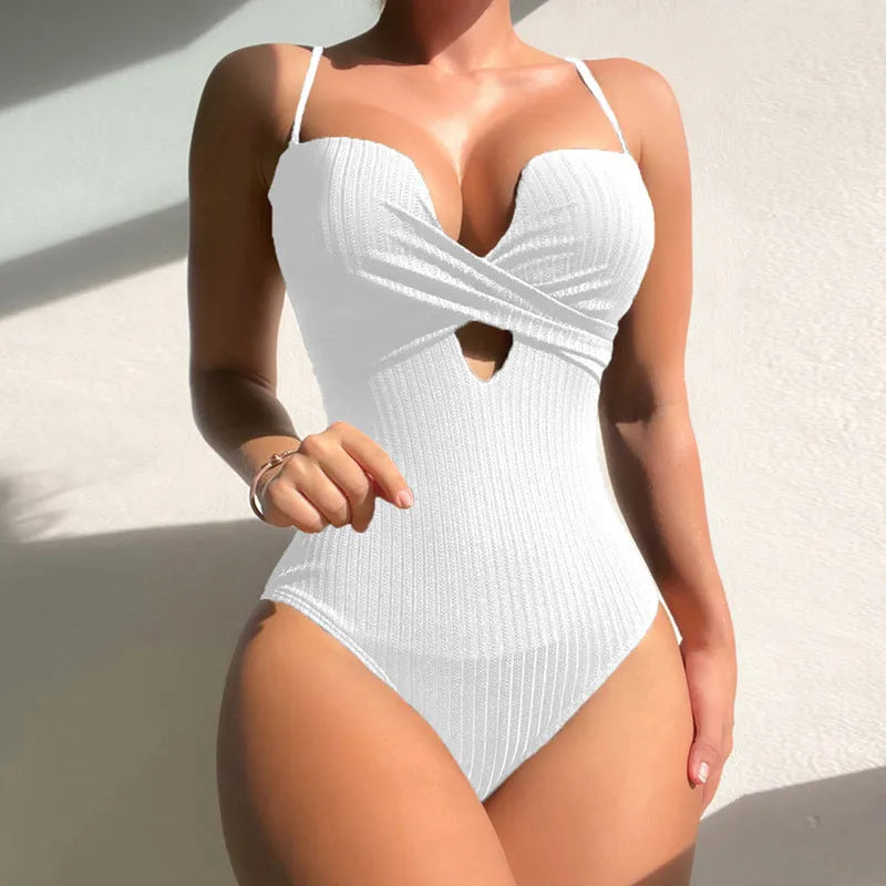 Women's solid colour one-piece swimsuit in polyester showing slimming silhouette